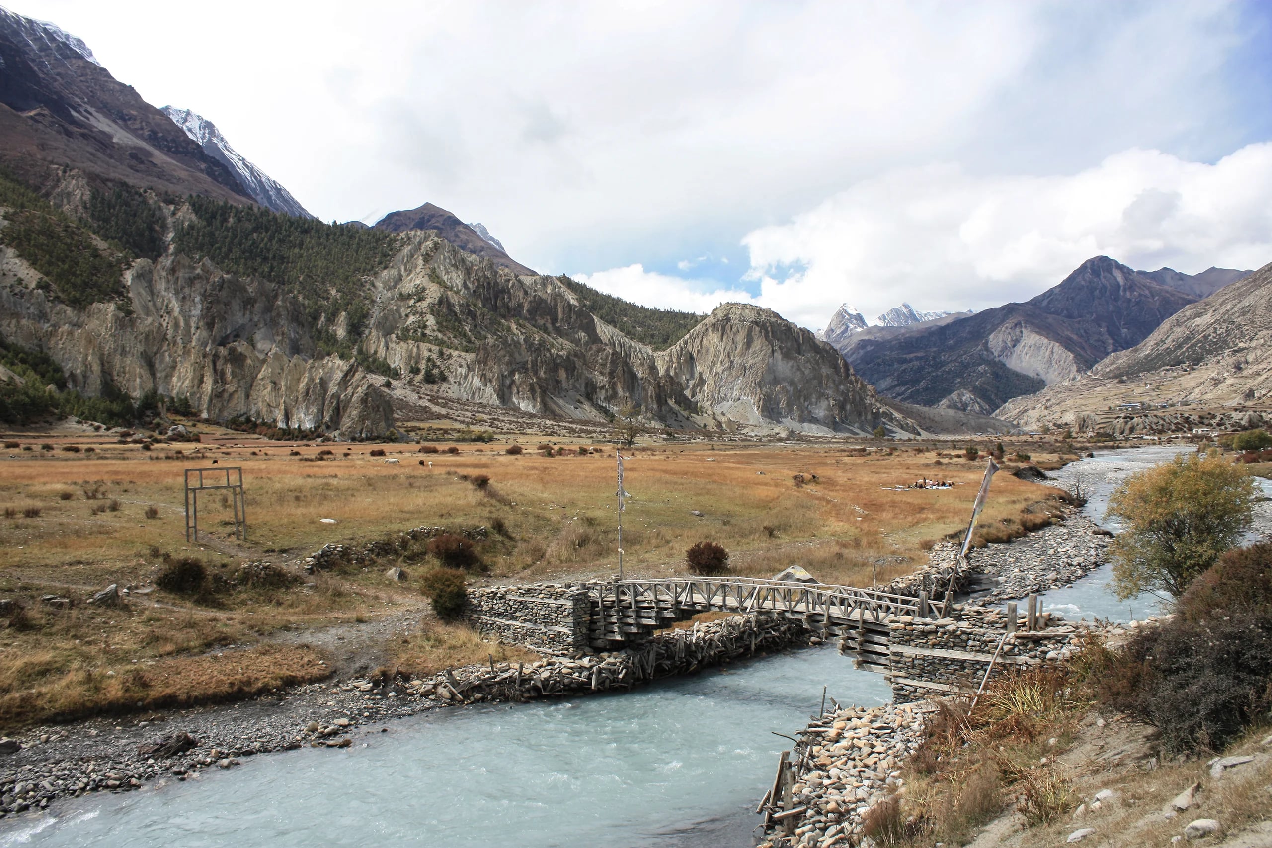 On the way to Manang, a river crossing and the village in the distance