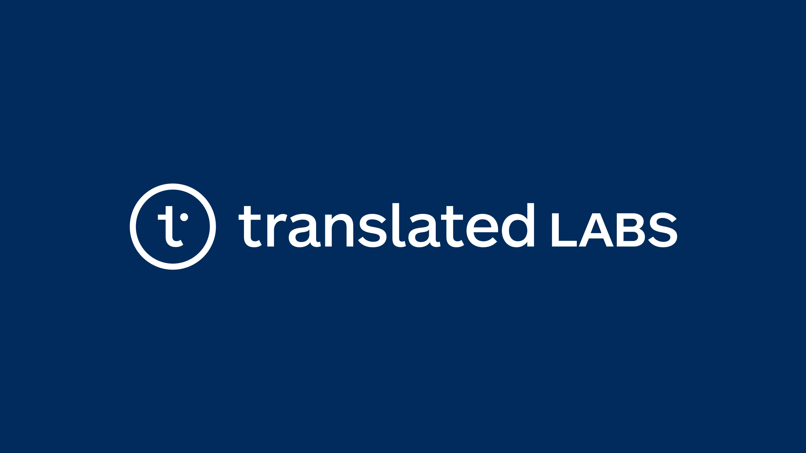 The Translated Labs lockup in white on navy: the circular t mark beside translated set in lowercase and LABS in small capitals
