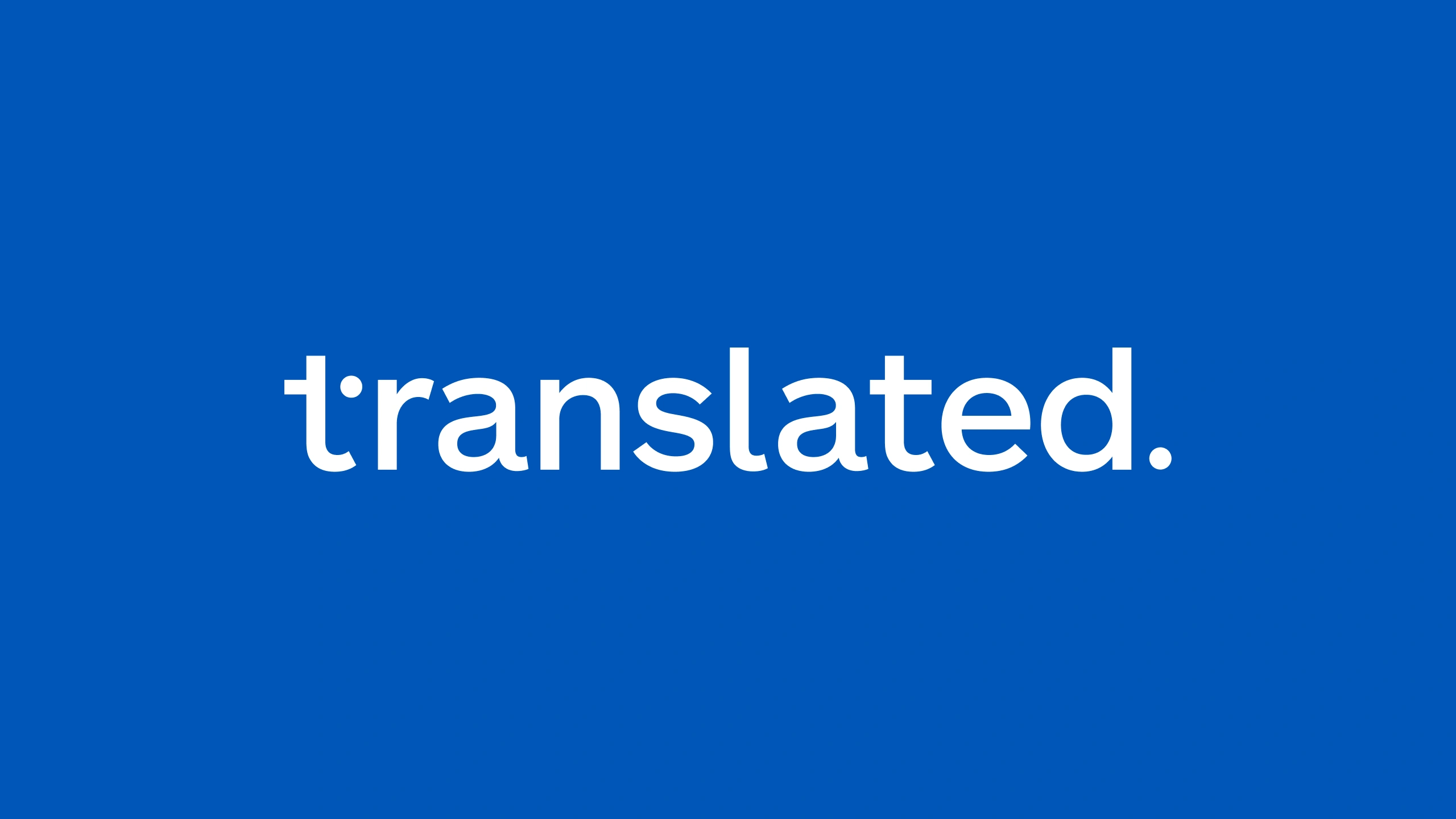 The translated wordmark in white on the brand blue, the dot of the t set high and to the right